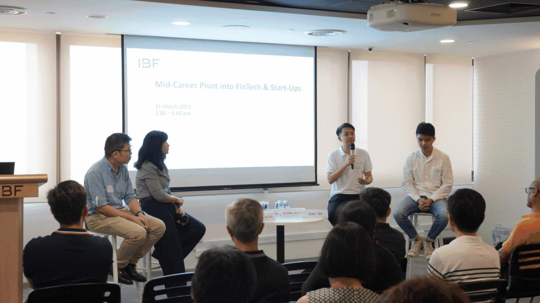 An automatic slideshow of various photos, showcasing people participating in IBF Careers Connect seminars.