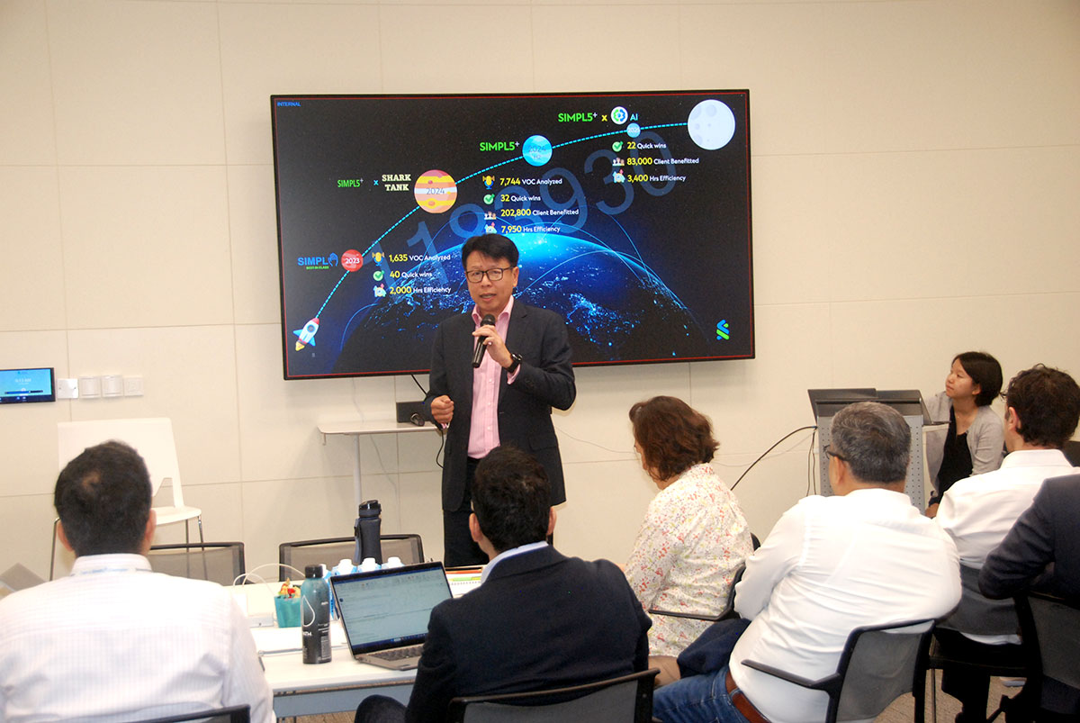 Andrew Chia presenting in front of a group.